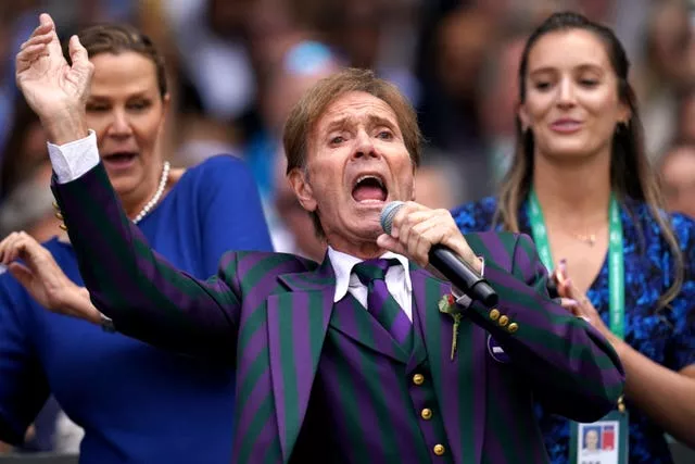Sir Cliff Richard with backing singers Pam Shriver (left) and Laura Robson