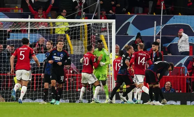 Andre Onana, centre, reacts after saving a penalty from FC Copenhagen’s Jordan Larsson, right