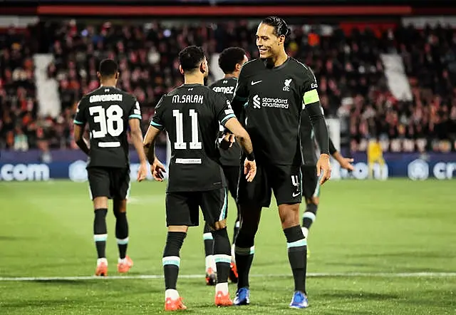 Liverpool’s Mohamed Salah celebrates with Virgil van Dijk