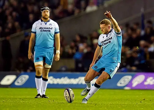 Finn Russell kicks a penalty for Scotland