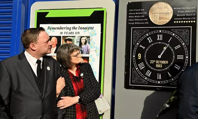 Gary Murray and Gina Murray during the unveiling and dedication on the Shankill Road in Belfast of the new memorial before a service to mark the 30th anniversary of the Shankill bomb in 2023