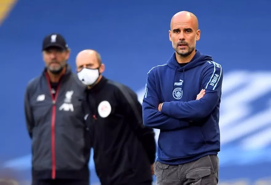 Pep Guardiola (right) is not expecting a repeat of City's 4-0 win over Liverpool in July