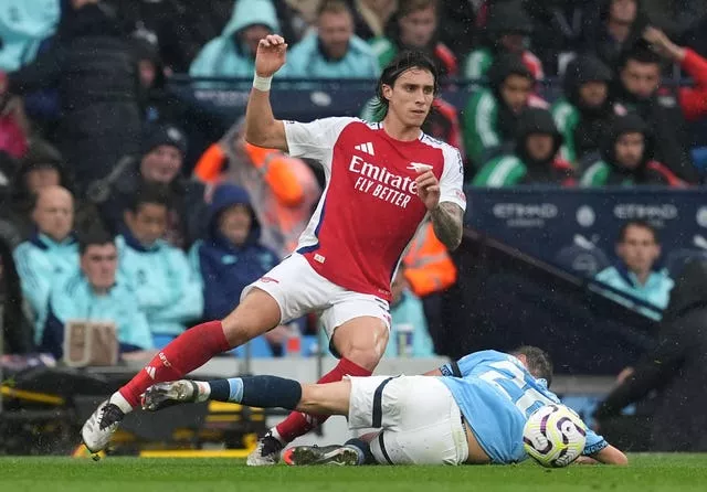 Riccardo Calafiori and Bernardo Silva battle for the ball during Manchester City's 2-2 draw with Arsenal