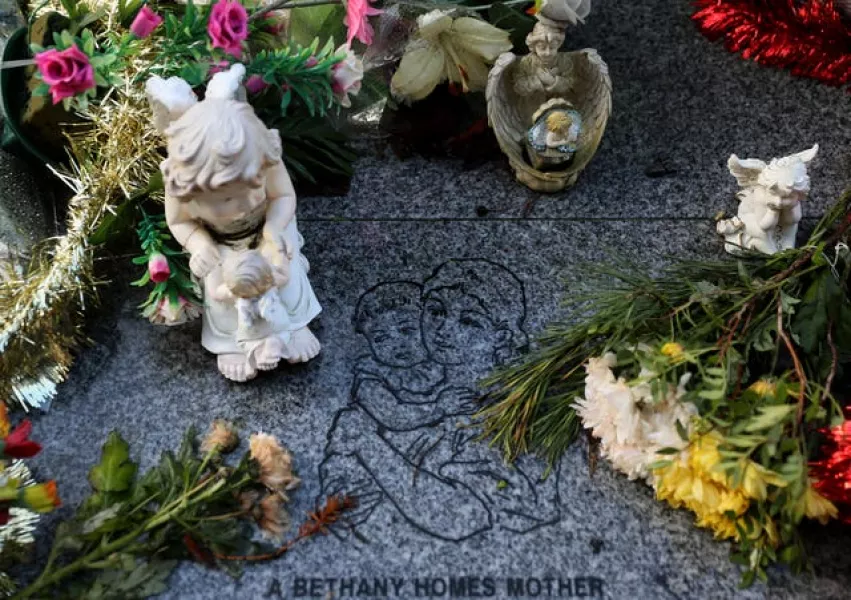 Flowers and figurines at the memorial to 222 children from the Bethany Mother and Child Home, at Mount Jerome Cemetery, Harold’s Cross, Dublin (Brian Lawless/PA)