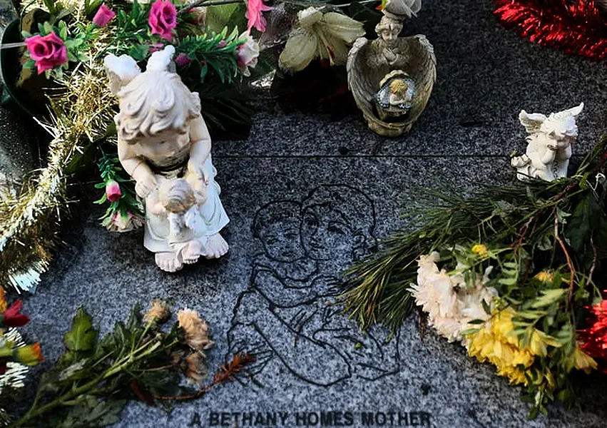 Flowers and figurines at the memorial to 222 children from the Bethany Mother and Child Home, at Mount Jerome Cemetery, Harold’s Cross, Dublin (Brian Lawless/PA)