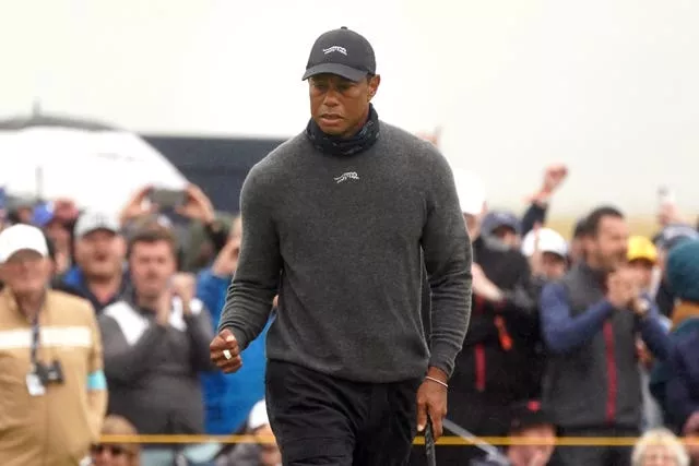 Tiger Woods celebrates a birdie at the Open with a fist pump