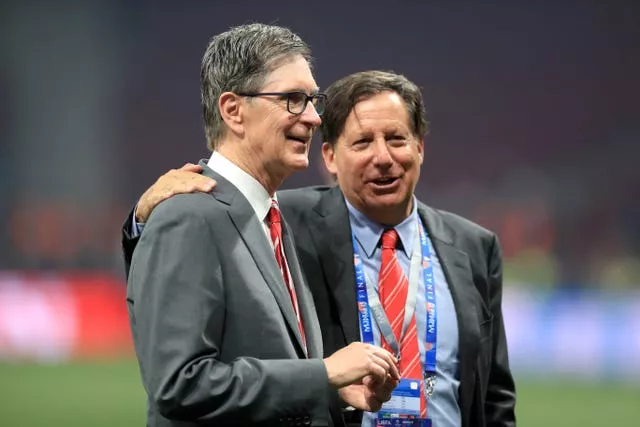 Liverpool owner John W. Henry (left) and chairman Tom Werner in conversation in a football stadium