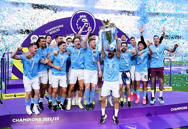 Ilkay Gundogan lifts the Premier League trophy 