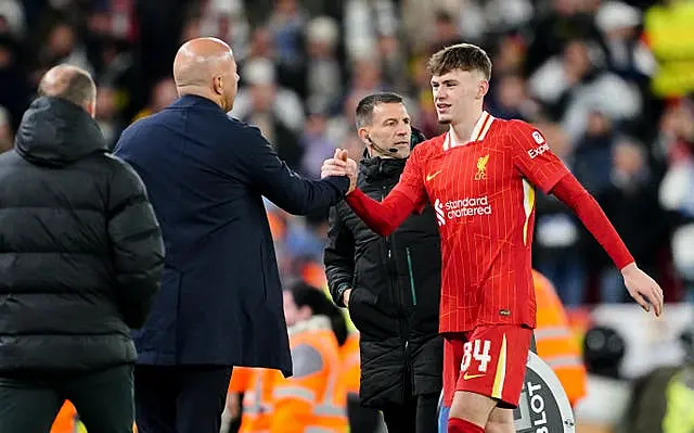 Liverpool’s Conor Bradley (right) is congratulated by manager Arne Slot