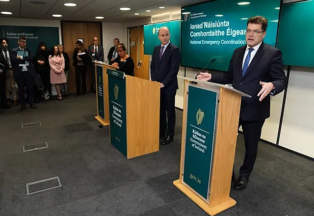 Tanaiste Micheal Martin, centre, and European Commissioner for Humanitarian Aid and Crisis Management Janez Lenarcic, right