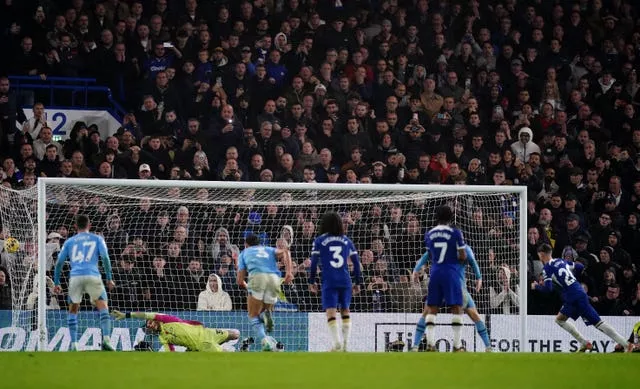 Cole Palmer, right, scores a last-minute penalty to earn Chelsea a 4-4 draw with Manchester City in November