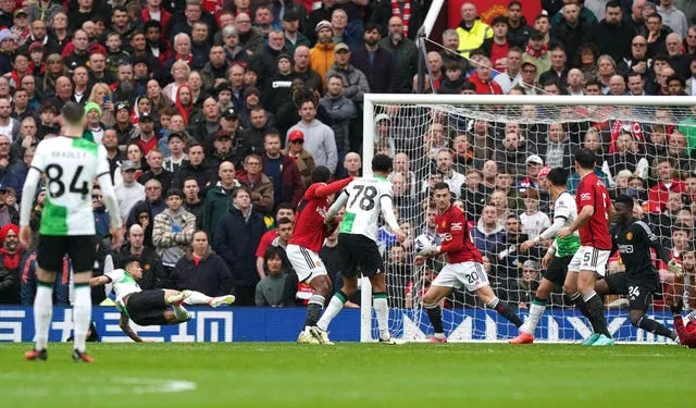 Luis Diaz, centre right, scores Liverpool’s first goal at Old Trafford on Sunday