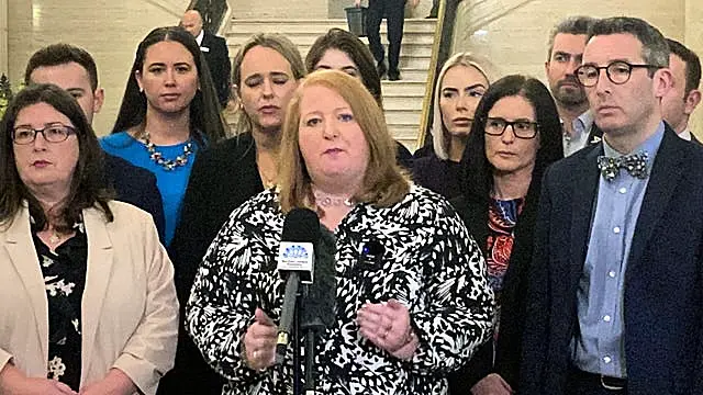 Alliance Party leader Naomi Long, centre, speaking to the media at Parliament Buildings Stormont, Belfast