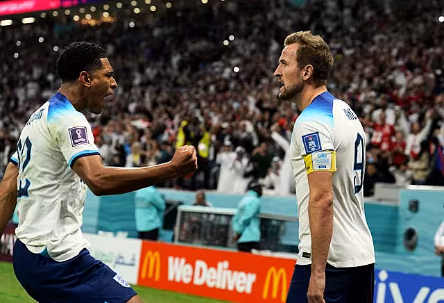 England’s Harry Kane (right) celebrates with Jude Bellingham after scoring their side’s first goal of the game from the penalty spot during the World Cup quarter-final against France