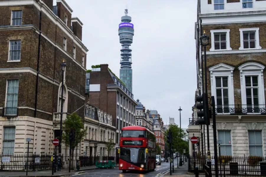 A digital message, which reads “Less URL, more IRL. Welcome back.” is displayed on the BT Tower Infoband, 190 metres above the streets of London as BT marks the latest phase of the Government’s Covid-19 lockdown measures easing (Anthony Upton/PA)