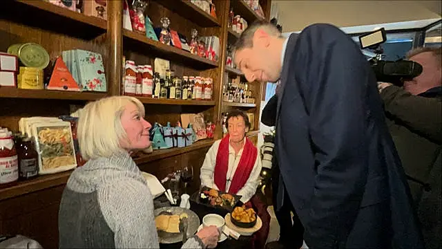 Simon Harris speaks to diners at a cafe