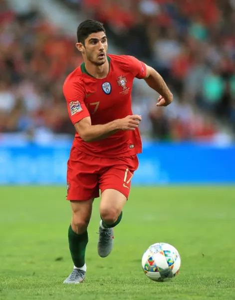 Goncalo Guedes runs forward with the ball in front of his feet