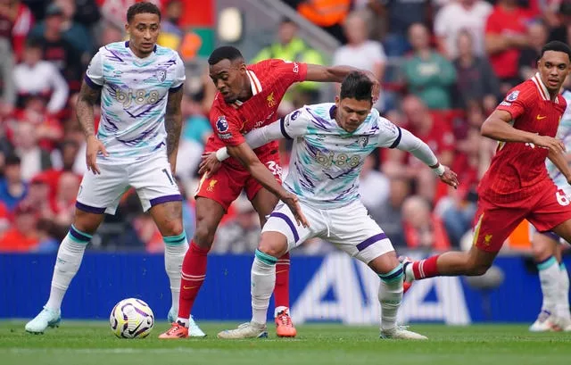 Ryan Gravenberch, second left, battles with Bournemouth's Evanilson