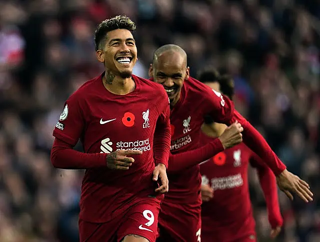 Roberto Firmino (left) celebrates for Liverpool