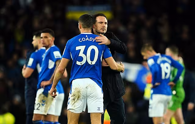 Everton manager Frank Lampard, right, consoles Conor Coady