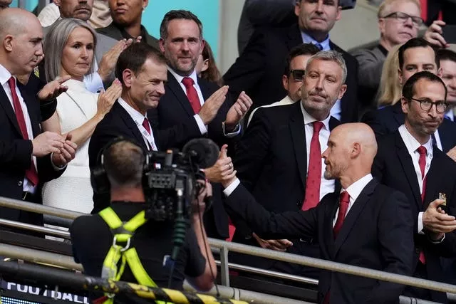 Dan Ashworth shakes hands with Erik ten Hag