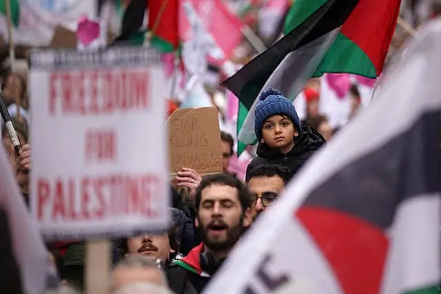 People in Dublin waving Palestinian flags during a pro-Palestinian march