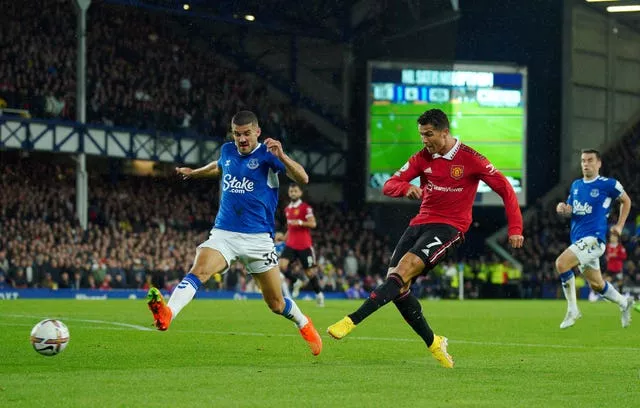 Cristiano Ronaldo, right, scores Manchester United's winner against Everton, his 700th goal in club football