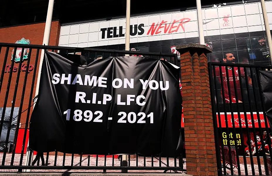 Banners are placed outside of Anfield, home of Liverpool FC by fans to protest against its decision to be included amongst the clubs attempting to form a new European Super League.