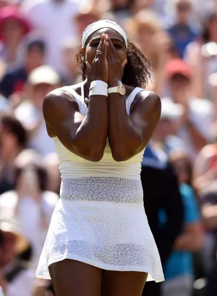 Serena Williams celebrates beating Garbine Muguruza in the Ladies’ Singles Final during day Twelve of the Wimbledon Championships at the All England Lawn Tennis and Croquet Club, Wimbledon
