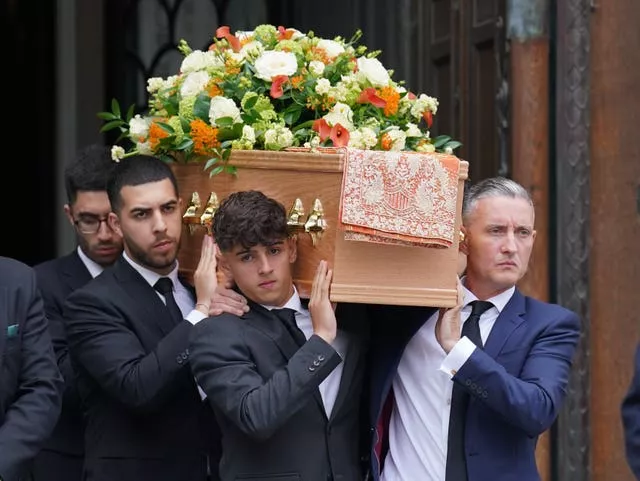 Grace O’Malley-Kumar's coffin is carried from her funeral at Westminster Cathedral