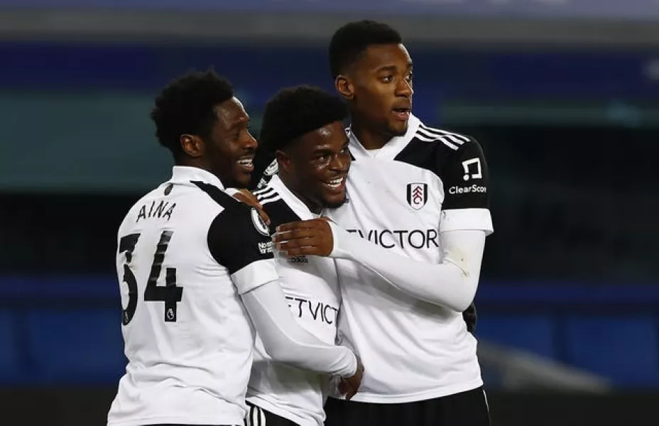 Fulham’s Josh Maja (centre) celebrates with Ola Aina (left) and Tosin Adarabioyo.