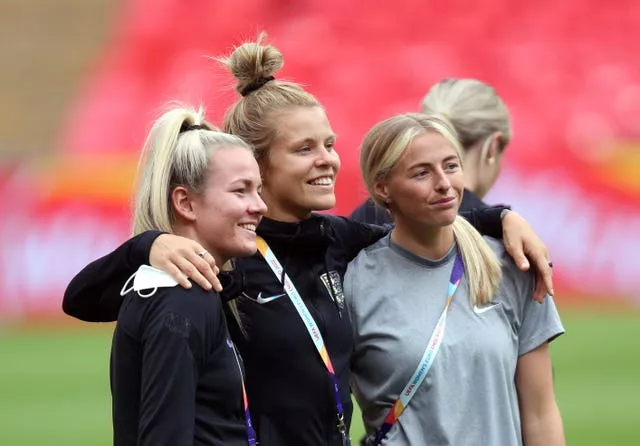 England’s Lauren Hemp, Rachel Daly and Chloe Kelly take in Wembley Stadium as they prepare for the Euro 2022 final.