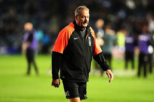 Fiji head coach Mick Byrne walks on the pitch