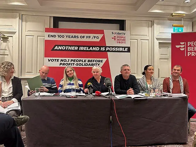 People Before Profit representatives, including Richard Boyd Barrett, XX, sit behind a table at the party’s manifesto launch