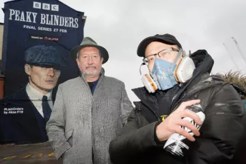 Peaky Blinders creator Steven Knight at the unveiling of a mural by artist Akse P19, right, of actor Cillian Murphy as Peaky Blinders crime boss Tommy Shelby in the historic Deritend area of Birmingham