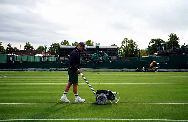 Ground staff preparing court on day two