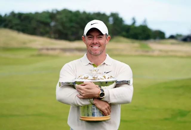 Rory McIlroy cradles the Genesis Scottish Open trophy