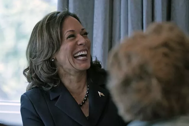 Kamala Harris laughs during a press conference in the White House