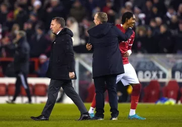 Brendan Rodgers, left, leaves the field as Forest celebrate their win