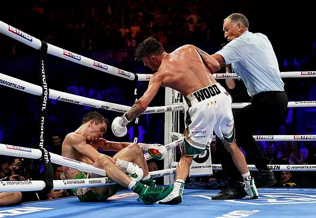 Michael Conlan falls out of the ring after being knocked out by Leigh Wood