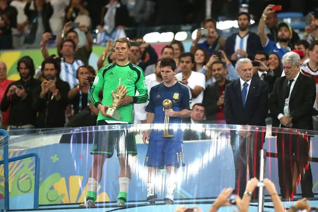 Germany goalkeeper Manuel Neuer, left, and Lionel Messi after collecting the Golden Glove and Golden Ball respectively in Brazil