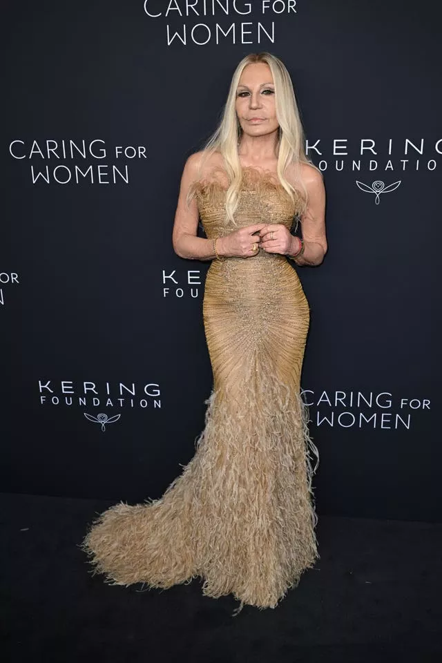 Donatella Versace poses on Kering Foundation’s Caring for Women dinner red carpet