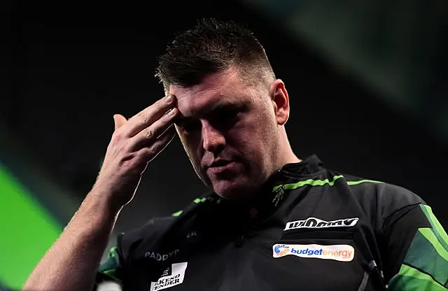 Daryl Gurney reacts on stage 