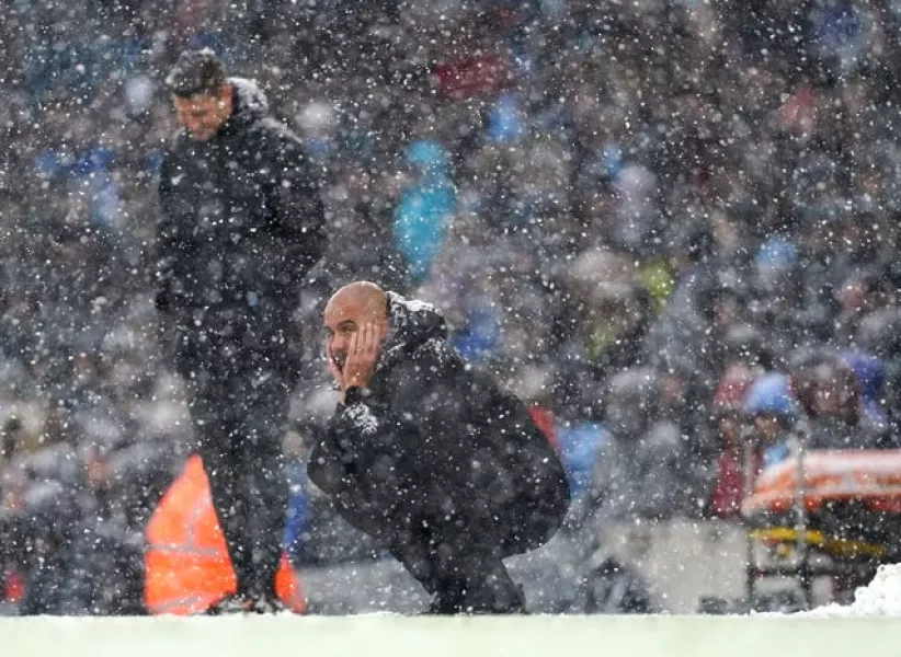Pep Guardiola watches on from the touchline 