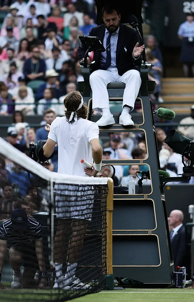 Stefanos Tsitsipas speaks to the umpire 