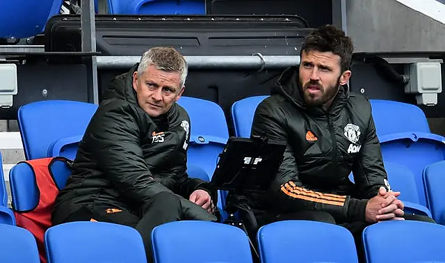 Ole Gunnar Solskjaer (left) and Michael Carrick in the dugout