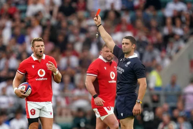 Referee Nika Amashukeli shows a red card to Owen Farrell, not pictured, after the bunker review system upgraded his sin-binning