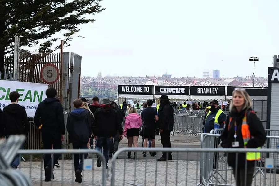 Revellers arrive at Circus nightclub in Bramley-Moore Dock, Liverpool, for a Covid safety pilot event 