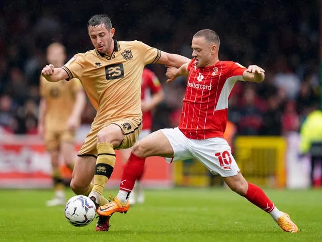 Port Vale’s Ben Garrity and Swindon Town’s Jack Payne battle for the ball