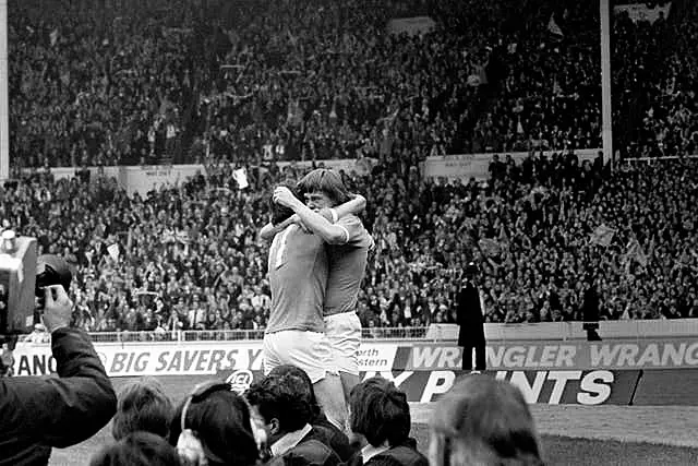 Manchester City’s Peter Barnes (right) celebrates scoring the opening goal with team-mate Dennis Tueart